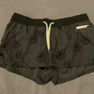 Vuori Black on Dark Grey Dandelion Print Workout Shorts, size L.
